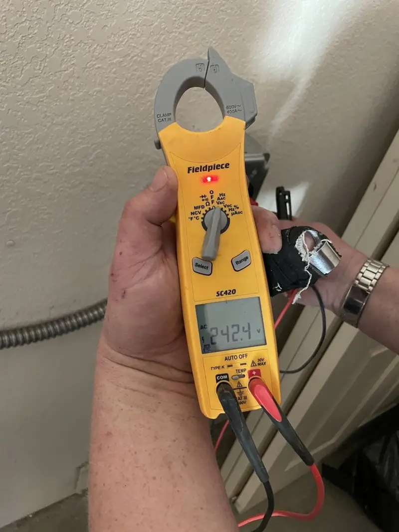 Voltage testing with clamp meter during Recessed Lighting Installation in Leominster